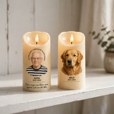 To Velora Minne minnelys side om side, ett med person og ett med hund